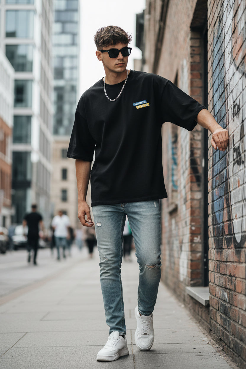 Black t-shirt with a logo on the chest against a white background