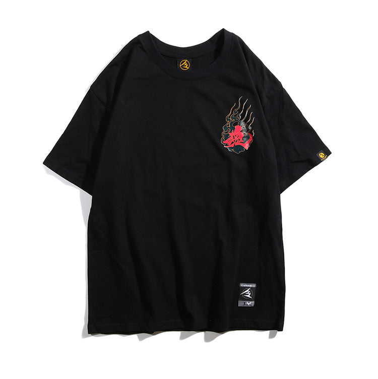 Black t-shirt with a graphic design on a white background