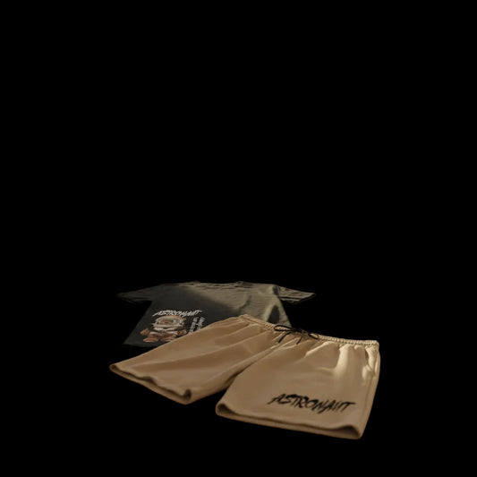 Black t-shirt with astronaut bear graphic and beige shorts with 'Astronaut' text on a white background