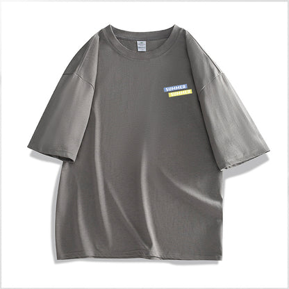 Gray t-shirt with a small colorful label on a white background