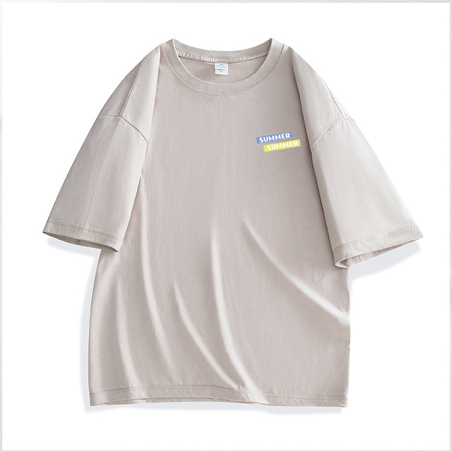 Beige t-shirt with a small colorful label on a white background
