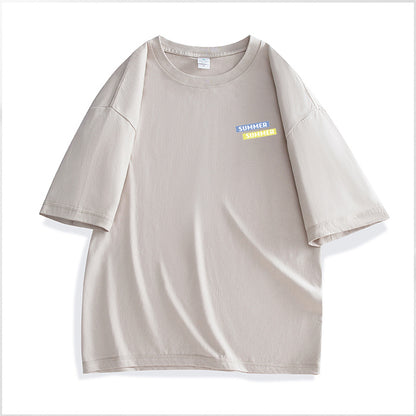 Beige t-shirt with a small colorful label on a white background