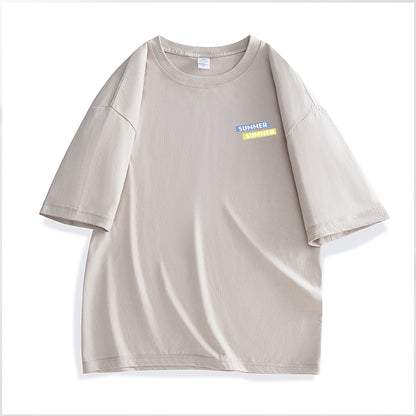 Beige t-shirt with a small colorful label on a white background