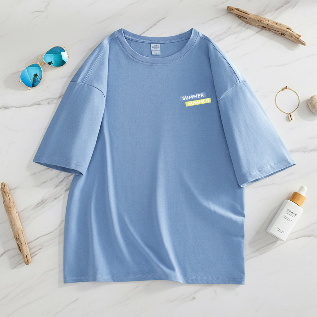 Blue t-shirt with a small yellow label on a white background