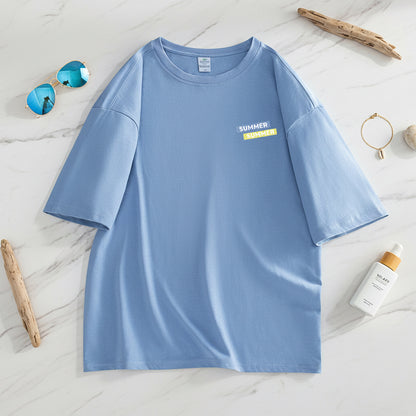 Blue t-shirt with a small yellow label on a white background