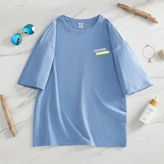 Blue t-shirt with a small yellow label on a white background